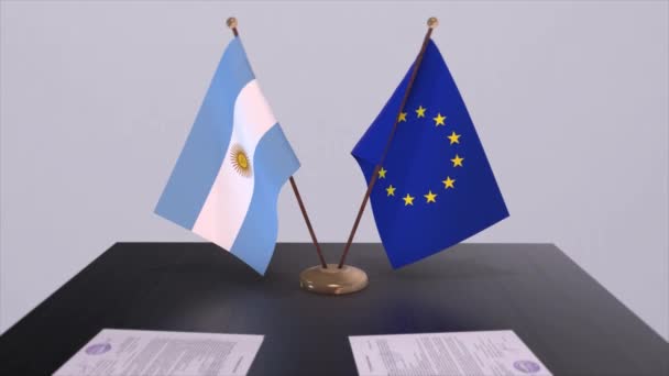 アルゼンチンとEuはテーブルの上に旗を掲げる 国との政治取引またはビジネス契約3Dアニメーション — ストック動画