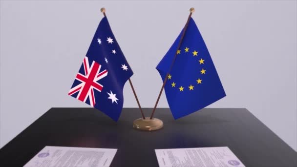 テーブルの上にオーストラリアとEuの旗 国との政治取引またはビジネス契約3Dアニメーション — ストック動画