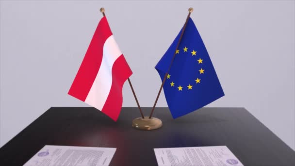 オーストリアとEuはテーブルの上に旗を掲揚 国との政治取引またはビジネス契約3Dアニメーション — ストック動画