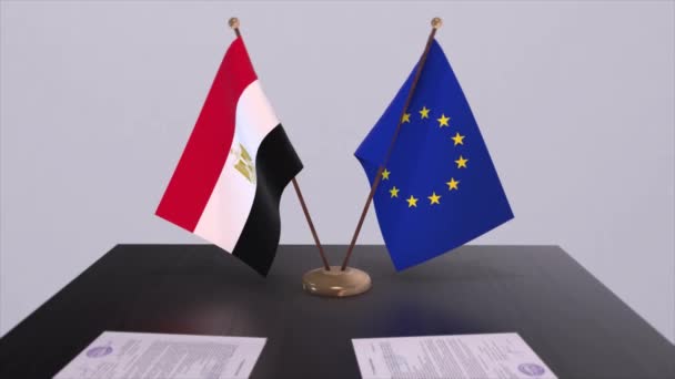埃及和欧盟的国旗在桌上 与国家3D动画的政治交易或商业协议 — 图库视频影像