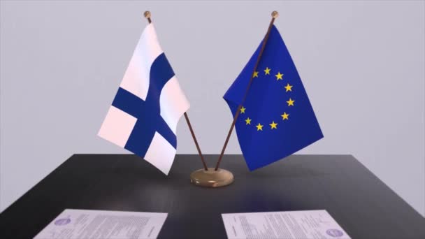フィンランドとEuはテーブルの上に旗を掲げる 国との政治取引またはビジネス契約3Dアニメーション — ストック動画