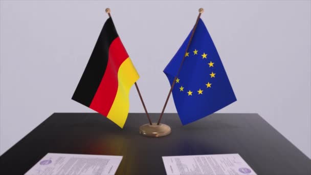 テーブルの上にドイツとEuの旗 国との政治取引またはビジネス契約3Dアニメーション — ストック動画