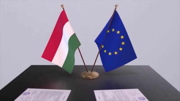 匈牙利和欧盟的国旗在桌上 与国家3D动画的政治交易或商业协议 — 图库视频影像