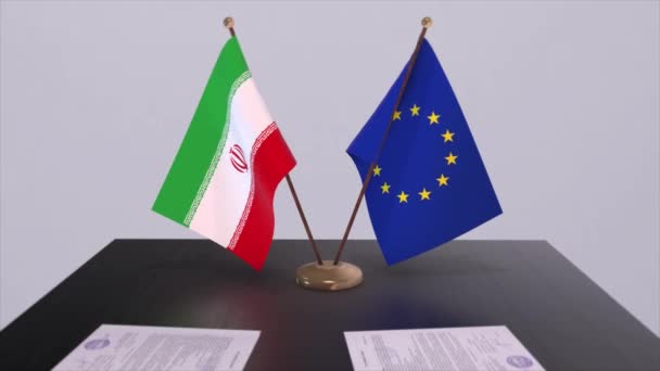 イランとEuはテーブルの上に旗を掲げる 国との政治取引またはビジネス契約3Dアニメーション — ストック動画