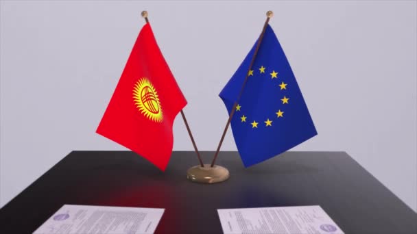 吉尔吉斯斯坦和欧盟的国旗在桌上 与国家3D动画的政治交易或商业协议 — 图库视频影像
