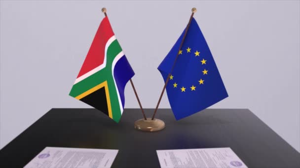 南アフリカとEuはテーブルの上に旗を掲げる 国との政治取引またはビジネス契約3Dアニメーション — ストック動画
