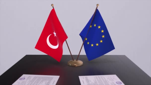 土耳其和欧盟的国旗在桌面上 与国家3D动画的政治交易或商业协议 — 图库视频影像