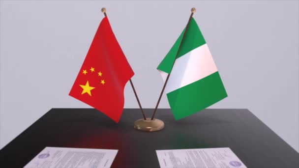 ナイジェリアと中国の国旗 政治概念 パートナー国間の取引 政府間のパートナーシップ協定 — ストック動画