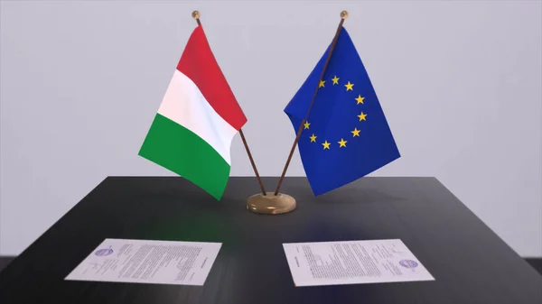 Italy and EU flag on table. Politics deal or business agreement with country 3D illustration.