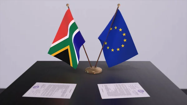 南非和欧盟的国旗在桌上 与国家3D说明的政治交易或商业协议 — 图库照片