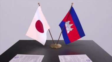 Kamboçya ve Japonya ulusal bayrakları, politik anlaşma, diplomatik toplantı. Politika ve iş animasyonu