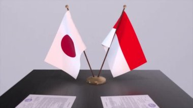 Endonezya ve Japonya ulusal bayrakları, politik anlaşma, diplomatik toplantı. Politika ve iş animasyonu
