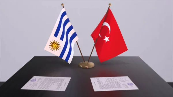 Uruguay and Turkey flags at politics meeting. Business deal 3D illustration.