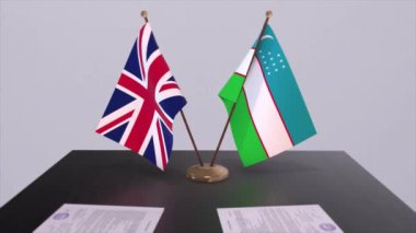 Özbekistan ve İngiltere bayrağı. Siyaset konsepti, ülkeler arasında ortaklık anlaşması. Hükümetlerin ortaklık anlaşması