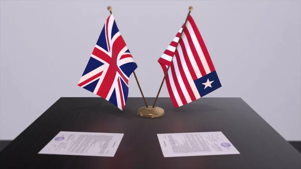 Liberia and UK flag. Politics concept, partner deal beetween countries. Partnership agreement of governments 3D illustration.