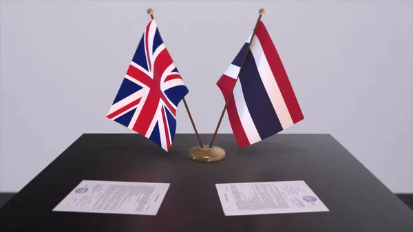 Thailand and UK flag. Politics concept, partner deal beetween countries. Partnership agreement of governments 3D illustration.
