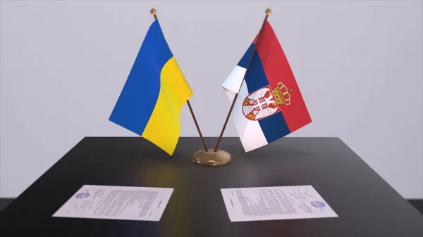Serbia and Ukraine flags on politics meeting 3D illustration.