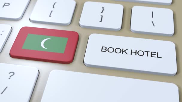 ホテルでモルディブ モルジブ コンピューターのキーボードのボタン 旅行のコンセプト3Dアニメーション ホテルのテキストとモルディブ国旗を予約する — ストック動画