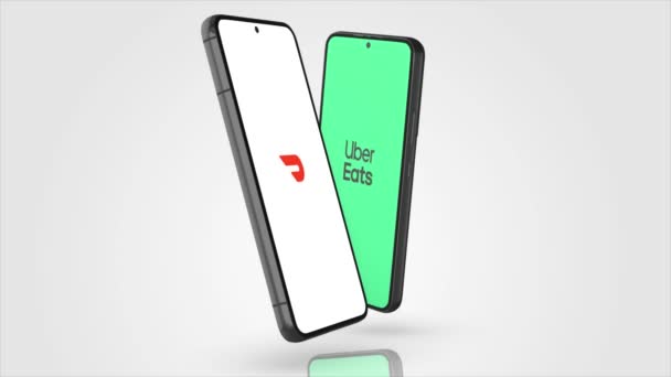 ニューヨーク アメリカ 2023年5月1日 DoordashとUber Eatsアプリのロゴが電話画面アニメーション イラスト編集 — ストック動画