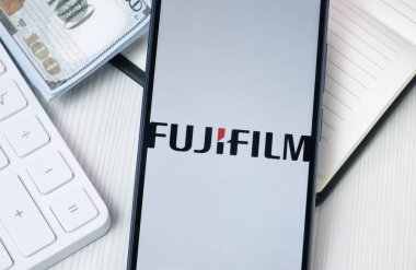 New York, USA - 30 June 2024: Fujifilm Logo on Phone Screen, Company Icon. clipart