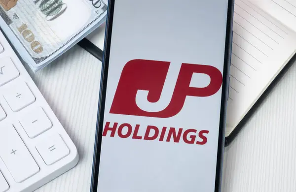 Stock image New York, USA - 30 June 2024: Japan Post Holdings Logo on Phone Screen, JP Company Icon.