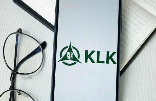 stock image New York, USA - 30 June 2024: Kuala Lumpur Kepong Logo on Phone Screen, KLK Company Icon.