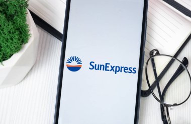 New York, USA - 30 June 2024: SunExpress Logo on Phone Screen, Company Icon. clipart