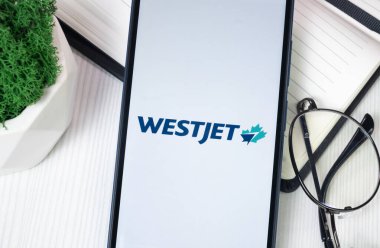 New York, USA - 30 June 2024: WestJet Airlines Logo on Phone Screen, Company Icon. clipart