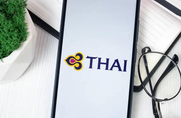 stock image New York, USA - 30 June 2024: Thai Airways Logo on Phone Screen, Company Icon.