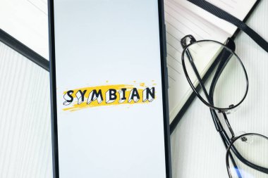 New York, USA - 30 June 2024: Symbian Logo or Icon on Phone Screen. clipart