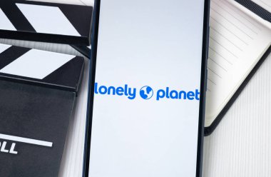 New York, ABD - 30 Haziran 2024: Yalnız Gezegen Logosu veya Telefon Ekranında Simge.