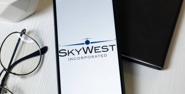 New York, USA - 1 June 2024: SkyWest Logo on Phone Screen, Company Icon. clipart