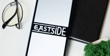 New York, USA - 1 June 2024: Eastside Distilling Logo on Phone Screen, Company Icon. clipart