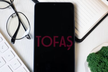 New York, USA - 1 June 2024: Tofas Logo on Phone Screen, Company Icon. clipart