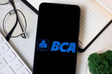New York, ABD - 1 Haziran 2024: Bank Central Asia Logo on Phone Screen, BCA Company Icon.