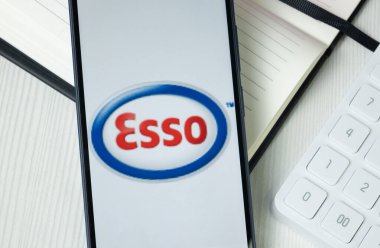 New York, USA - 30 June 2024: Esso Logo on Phone Screen, Company Icon. clipart