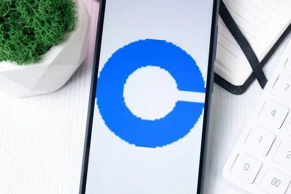 stock image New York, USA - 1 August 2024: Coinbase Exchange Logo on Phone Screen, Crypto Exchange Company Sign.