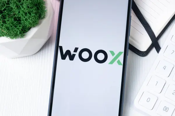 stock image New York, USA - 1 August 2024: woo x Logo on Phone Screen, Crypto Exchange Company Sign.