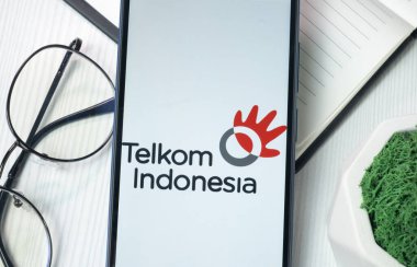 New York, USA - 21 June 2024: Telkom Indonesia Logo on Phone Screen, Company Icon. clipart