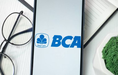 New York, USA - 21 June 2024: Bank Central Asia Logo on Phone Screen, BCA Company Icon. clipart