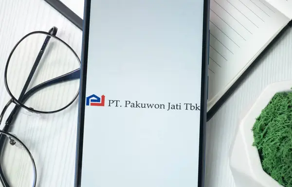 stock image New York, USA - 21 June 2024: Pakuwon Jati Tbk Logo on Phone Screen, Company Icon.