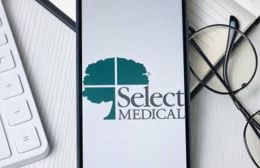 New York, ABD - 21 Haziran 2024: Telefon Ekranında Tıbbi Holding Logosunu Seç, Şirket Simgesi.