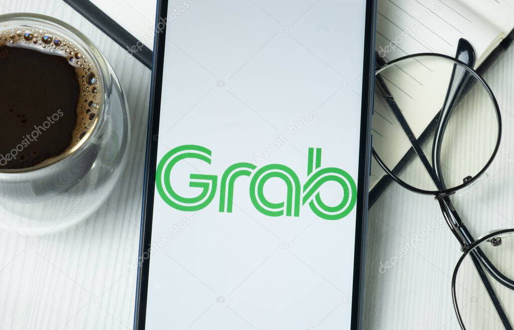 New York, USA - 21 June 2024: Grab Holdings Logo on Phone Screen, Company Icon.