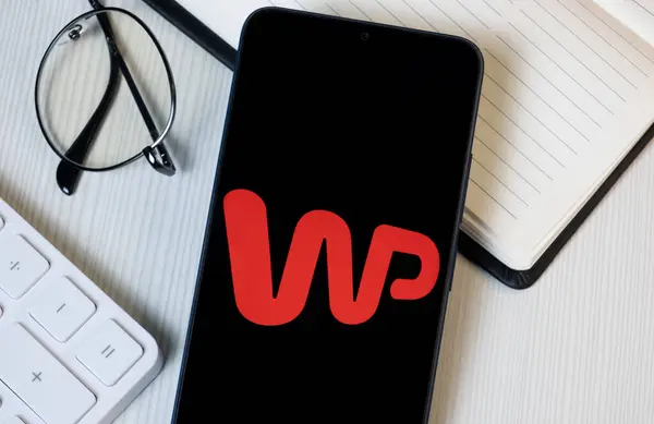 stock image New York, USA - 21 June 2024: WP Holding Logo on Phone Screen, Wirtualna Polska Company Icon.