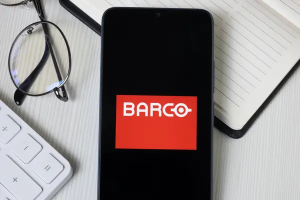 Stock image New York, USA - 21 June 2024: BARCO Logo on Phone Screen, Company Icon.