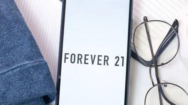 stock image New York, USA - 21 June 2024: Forever 21 Logo on Phone Screen, Company Icon.