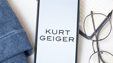 New York, USA - 21 June 2024: Kurt Geiger Logo on Phone Screen, Company Icon. clipart