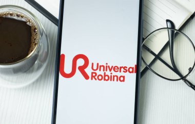 New York, USA - 21 June 2024: Universal Robina Logo on Phone Screen, Company Icon. clipart