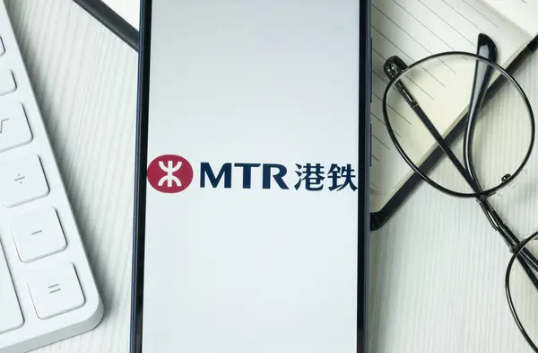 stock image New York, USA - 21 June 2024: MTR Corporation Logo on Phone Screen, Company Icon.