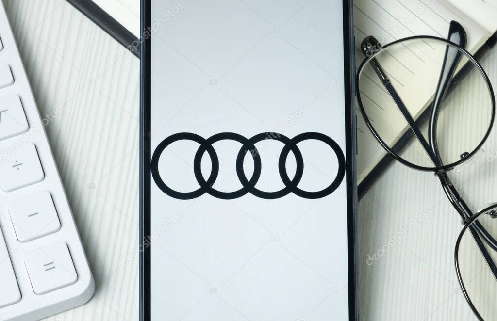 New York, USA - 21 June 2024: Audi Logo on Phone Screen, Company Icon.